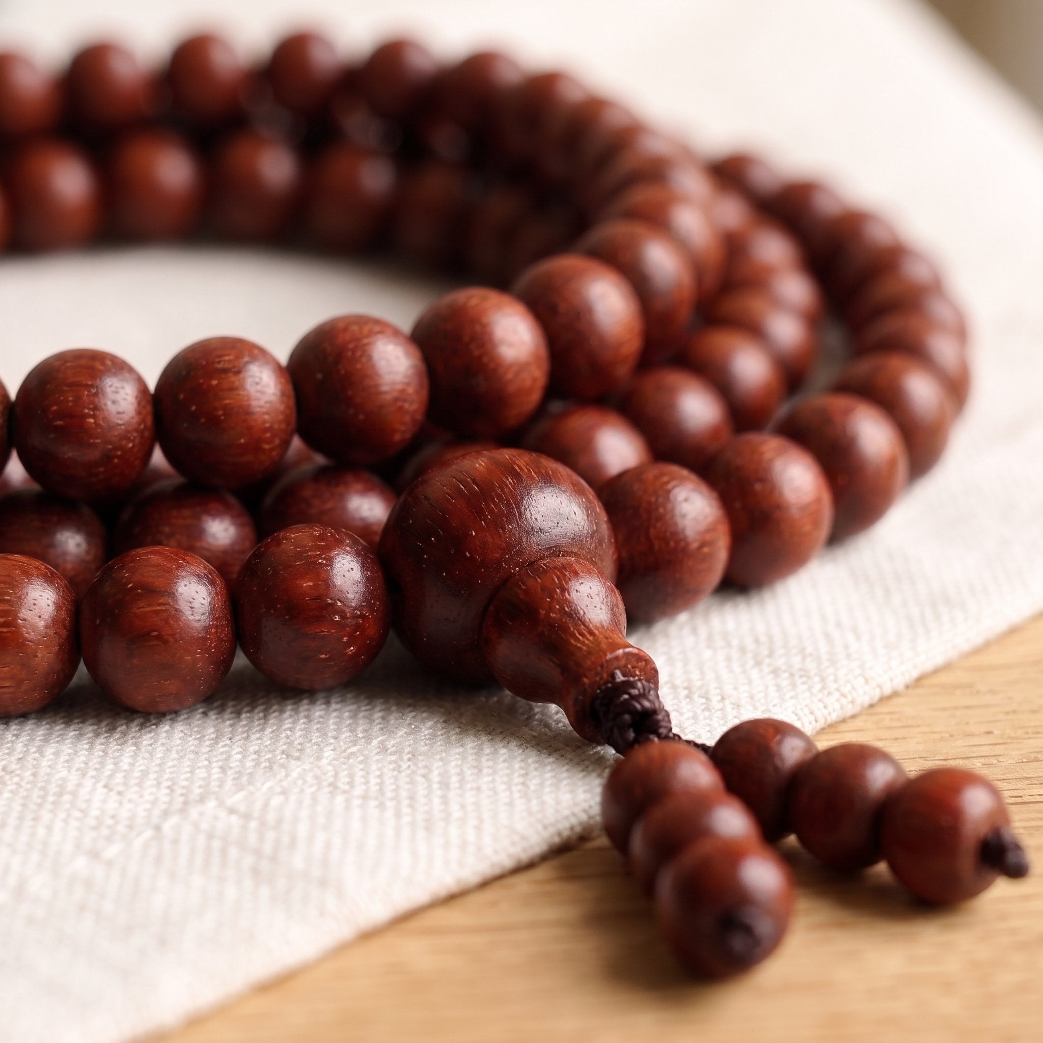 Lal chandan red sandalwood mala guru bead closeup for japa and meditation