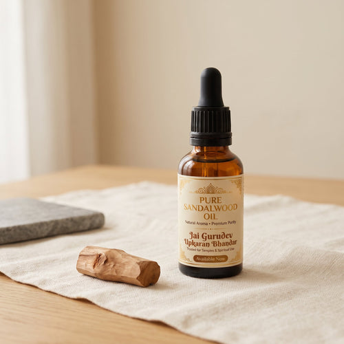 Pure sandalwood oil bottle by Jai Gurudev Upkaran Bhandar with raw chandan wood - for pooja, meditation and skincare