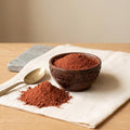Pure lal chandan red sandalwood powder in carved bowl for face pack and tilak